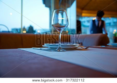 Selective Focus. Empty Glasses Set In Restaurant . Closeup Image Of Empty Glass Ar Blurred Restauran
