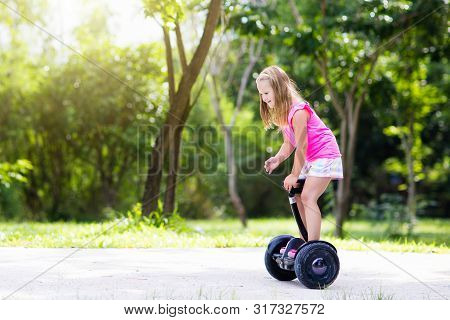 Child On Hover Board. Kids Riding Scooter
