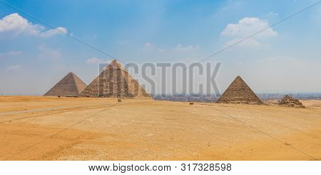 Egyptian Pyramids With A Beautiful Sky At Giza In Cairo