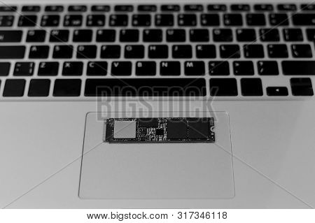 Ssd Drive Chip On The Bottom Of The Laptop. Horizontally On The Trackpad. The Bottom Buttons Are Not