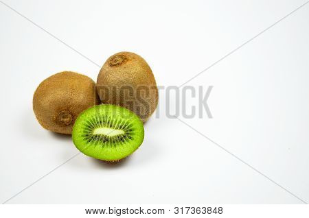 Fresh Juicy Kiwi Fruit And A Slice Cut Isolated On White Background