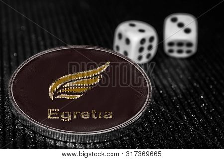 Coin Cryptocurrency Token Egretia Egt And Rolling Dice.