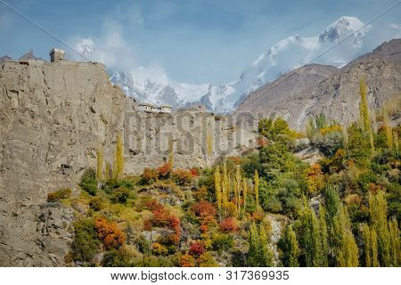 Nature Landscape View Of Colorful Foliage In Hunza Valley In Autumn Season. Altit Fort On Hill Top A