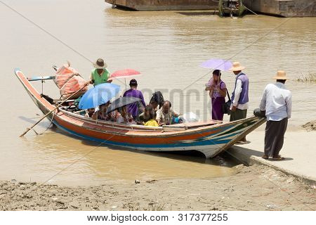 Yangon, Myanmar-may 8th 2014: Passengers Board A Ferry. Ferries Are Regularly Used To Cross The Rive