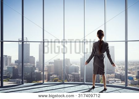 Businesswoma in office interior. Mixed media