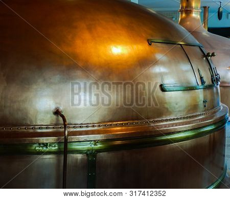 Close Up Of A Golden Beer Vat In A Brewery.