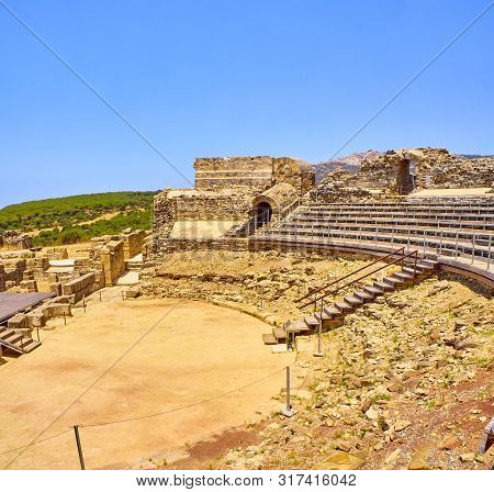 Remains Of The Roman Theatre Of The Baelo Claudia Archaeological Site. Tarifa, Cadiz. Andalusia, Spa