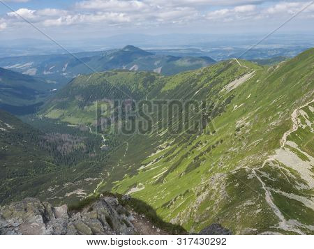 View From The Smutne Sedlo Saddle On Smutna Dolina Valley With Beautiful Blue Mountain Lake Tatialko