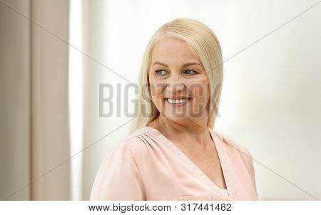 Portrait Of Happy Mature Woman At Home