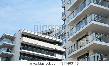 Contemporary Residential Building Exterior In The Daylight. Modern Apartment Buildings On A Sunny Da