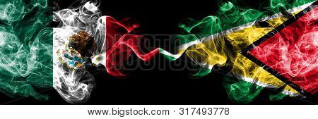 Mexico Vs Guyana, Guyanese Smoky Mystic Flags Placed Side By Side. Thick Colored Silky Abstract Smok