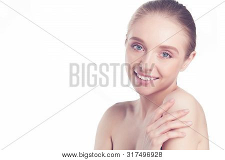 Portrait Of Beautiful Woman With Natural Make Up Touching Her Face.