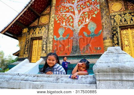 Luang Prabang, Laos - February 17, 2018: Groups of local visitors are visiting famous Wat Xiengthong