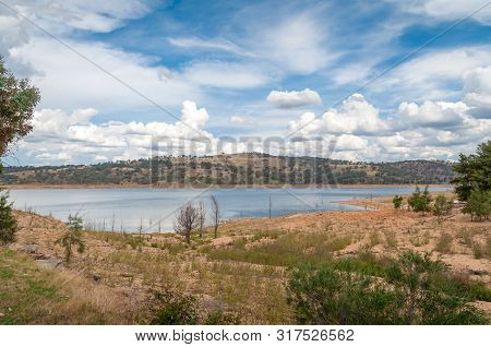 Beautiful Nature Landscape With Blue Lake, Dam And Tree Covered Hills On The Background. Wyangala, A