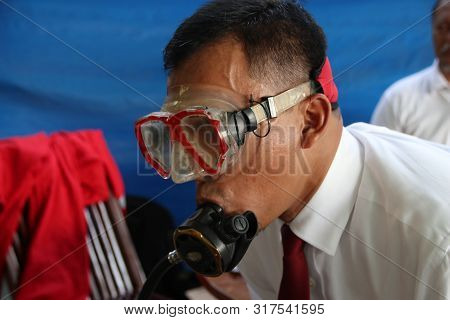 A Group Of People Doing Diving Training In A Swimming Pool In Batang / Central Java, Indonesia, Augu