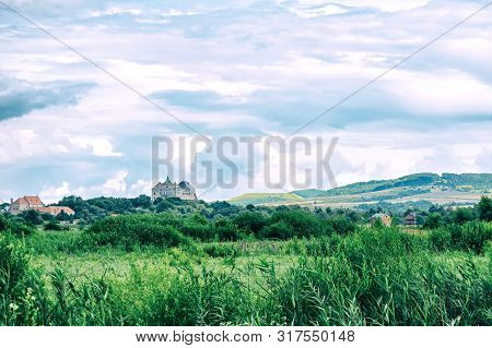 A Beautiful View Of The Castle, Among Beautiful Nature And A Beautiful Cloudy Sky. Ukraine. Olesky C