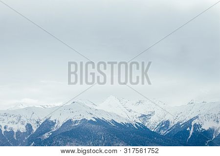 Winter Panorama View Of Mountains. Cold Winter Maille Cloudy Day In Mountains