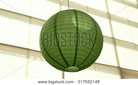 A Green Rice Lamp Hanging From The Roof Of The Ersboda People's House In Umea
