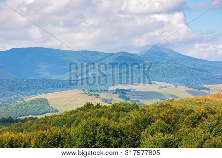 Wonderful Autumn Mountain Landscape. Pikui Peak Of Watershed Ridge Beneath Clouds. Wonderful Carpath