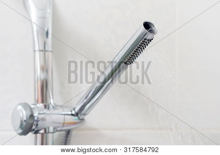 Shower Head With Water Stream. Modern Shower Head In Modern Bathroom. Shower Head With Refreshing Wa