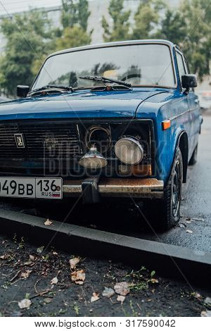 Voronezh, Russia August 17, 2019: Forgotten Rusty Car On Road. Abandoned Rusty Old Car On Road. Car 