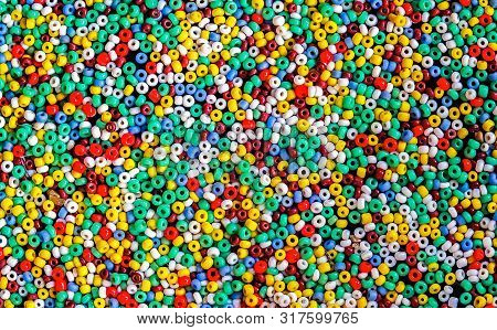 Lots Of Colorful Fusible Plastic Beads Used For Arts And Craft.