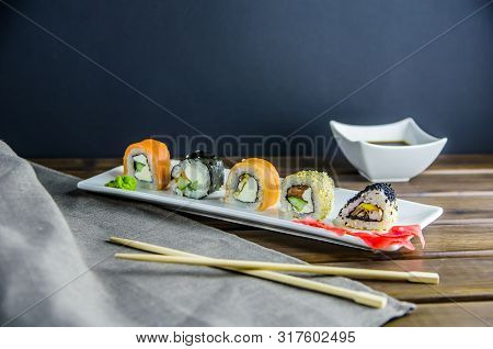 Different Rolls On A White Rectangular Plate