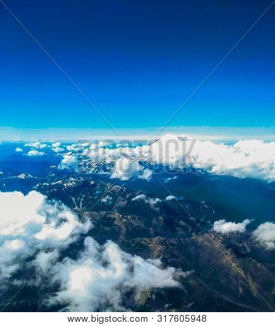 Mt Ranier In Clouds From High Above