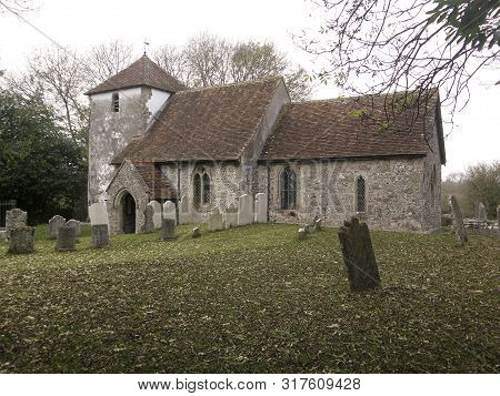 Landscape View Of St Mary-the-virgin Church In Winterbourne Gunner, Wiltshire, A Norman Stone Church