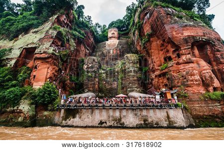 Wide Angle View Of Leshan Giant Buddha Or Dafo From River Boat In Leshan Sichuan China