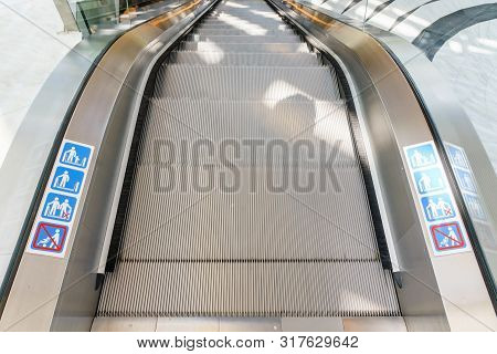 Escalator In Community Mall, Shopping Center. Moving Up Staircase. Electric Escalator. Close Up To E