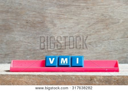 Tile Letter On Red Rack In Word Vmi (abbreviation Of Vendor Managed Inventory) On Wood Background