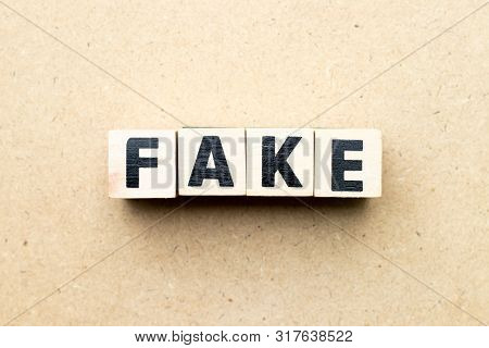 Letter Block In Word Fake On Wood Background