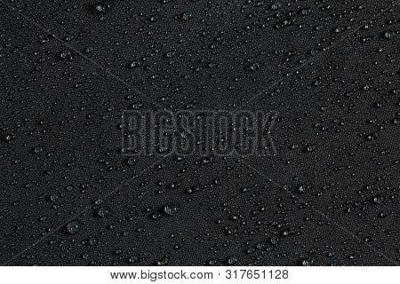 Dark Gray Waterproof Hydrophobic Flat Cloth Closeup With Rain Drops Background