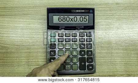Old Calculatator On Wooden Table, Vintage Tone Of Calculator On Wooden Background, Top View Of Calcu