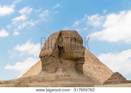 The Sphinx Stand At The Pharaoh's Entrance Tomb Complex In Giza