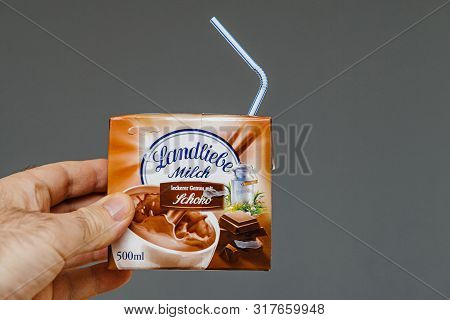 Paris, France - Mar 16, 2019: Man Hand Holding Landliebe Milch Milk With Chocolate Taste