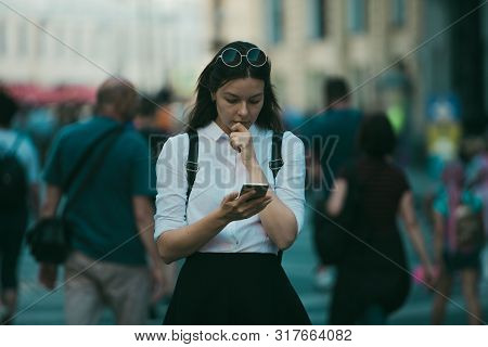 Girl On The Street Among The Crowd Of Passers-by, Photos In The Style Of Surveillance. Young Woman I
