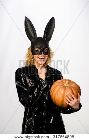 Girl In Black Bunny Mask With Pumpkin. 31 October. Halloween Costume. Sexy Girl In Bunny Mask With J