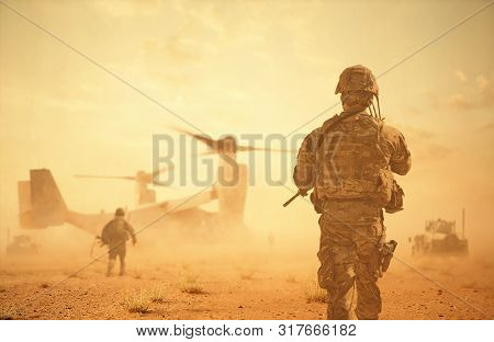 Military Helicopters And Forces Between Storm & Dust In Battlefield