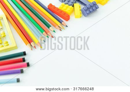 Back To School. School Background With Supplies. Pencils And School Equipment. Multi-colored Objects