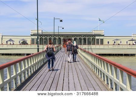 Malmo, Sweden - June 24, 2019: Ribersborgs Open-air Bath, Wooden Pier In The Baltic Sea With Walking
