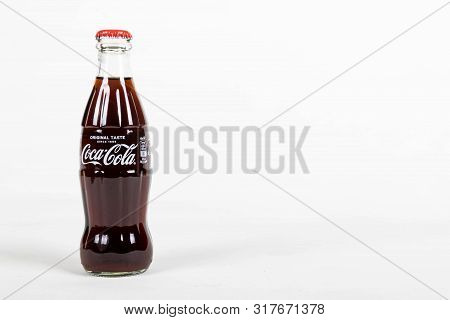 London, United Kingdom, 16th August 2019:- A Coca-cola Glass Bottle. Contains 10.6g Of Sugar Per 100