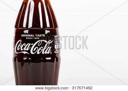 London, United Kingdom, 16th August 2019:- A Coca-cola Glass Bottle. Contains 10.6g Of Sugar Per 100
