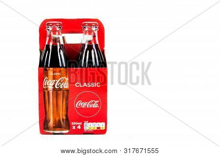 London, United Kingdom, 16th August 2019:- A Pack Of 4 Coca-cola Glass Bottles. Contains 10.6g Of Su