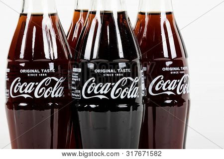 London, United Kingdom, 16th August 2019:- A Pack Of 4 Coca-cola Glass Bottles. Contains 10.6g Of Su