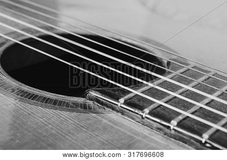 Details Of An Old Acoustic Guitar, The Sound Hole, Frets And Nylon Strings. Wooden Acoustic Guitar, 