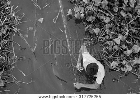 Mandalay, Myanmar - 03 December, 2018: From Top To Bottom Picture Of Local Burmese Fisherman Using A