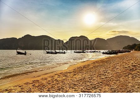 Beautiful Sunset With Fishing Boat In Thailand. Tropical Island In Asian Sea.