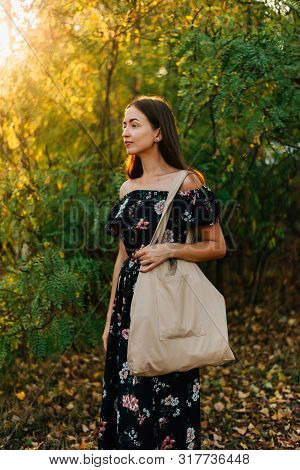 Caucasian Girl Holds Linen Shopper On Sunset Outdoors. Zero Waste Eco Friendly Conscious